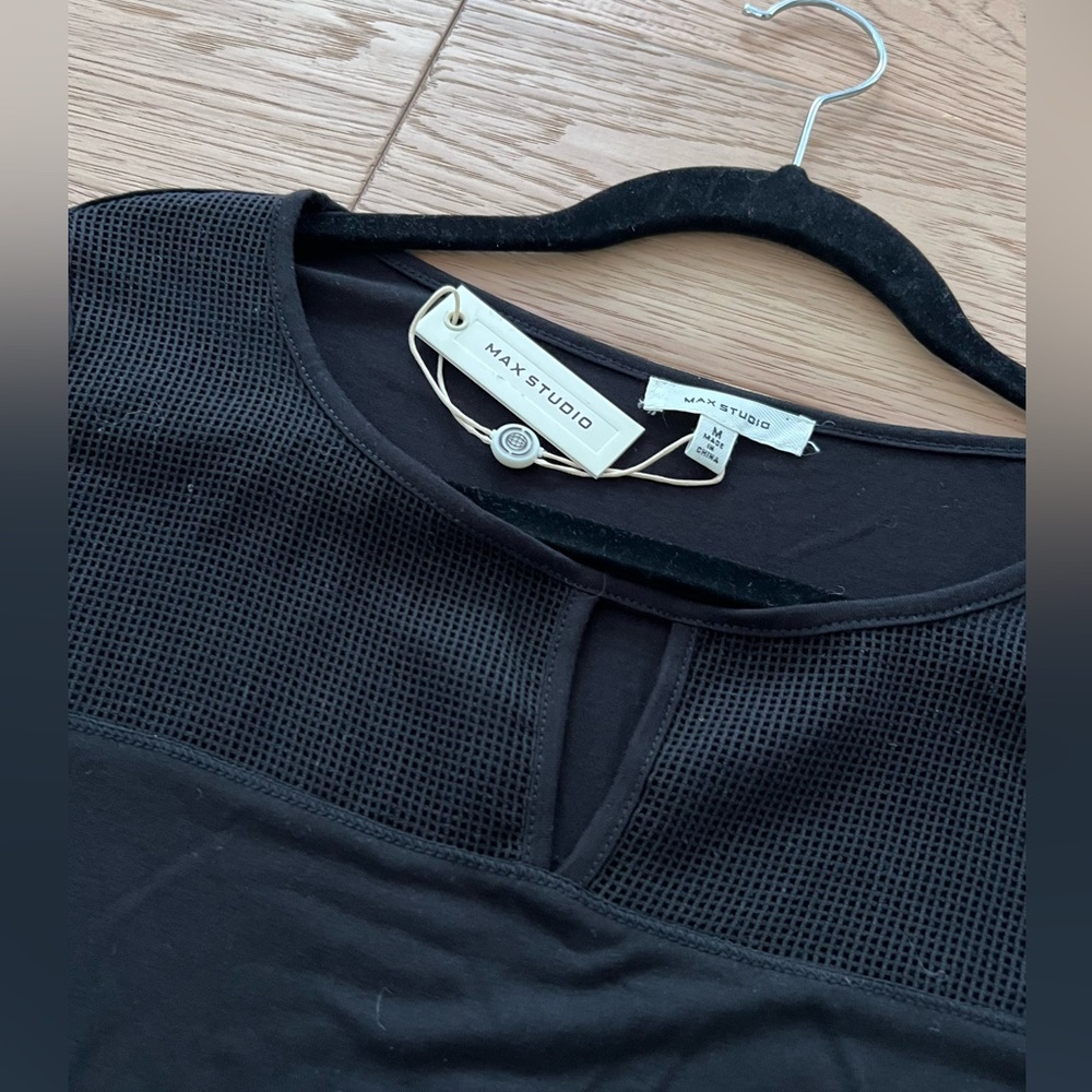 NWT black long top with cut out and mesh detail